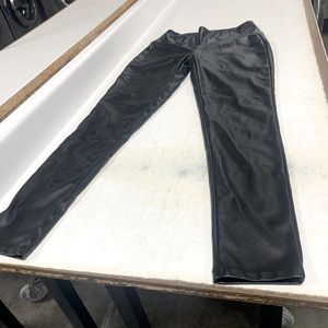 Black leather type skinny jeans.
